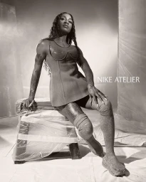 Sha'Carri Richardson in a fitted athletic top and high socks posing on a wrapped stool for Nike Atelier