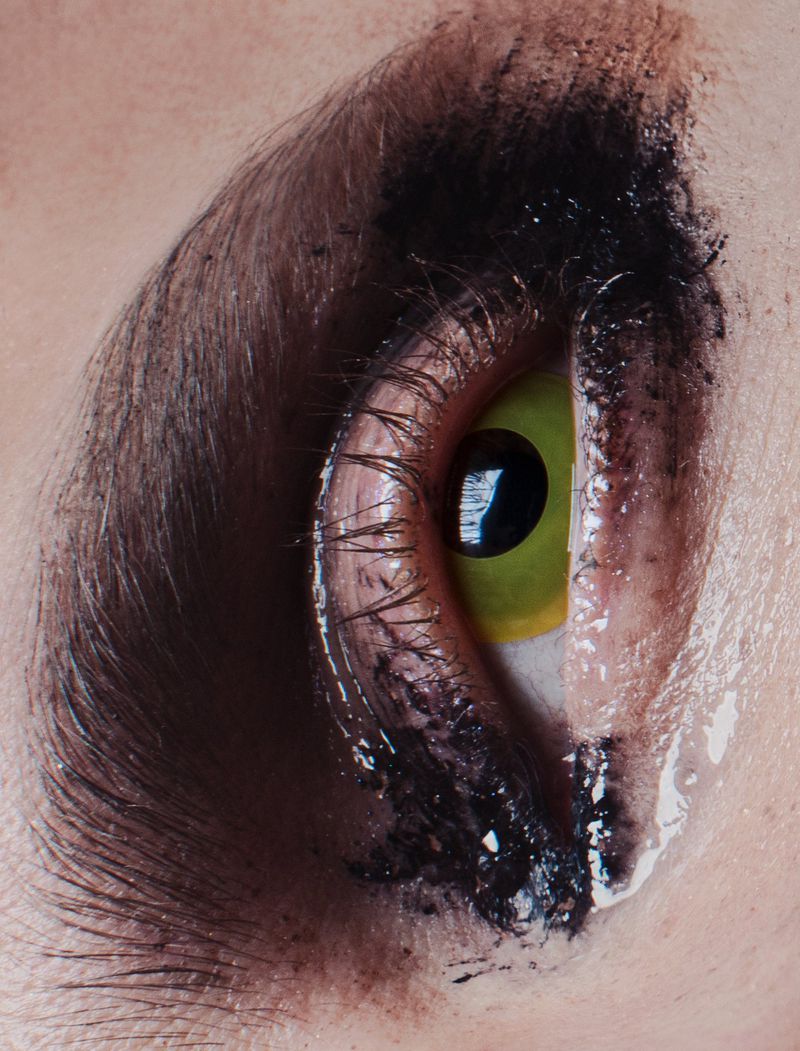 Close-up macro shot of a person eye with smudged black makeup and long eyelashes for 10 Men Magazine Heritage Issue