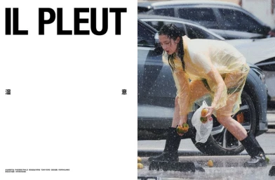 Model Xiao Wen Ju wearing a translucent yellow raincoat and dark boots outdoors in the rain for a Numero China fashion editorial.