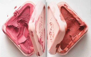 Two triangular pink compact cases with sculpted textured cosmetic makeup product inside against a plain white background.