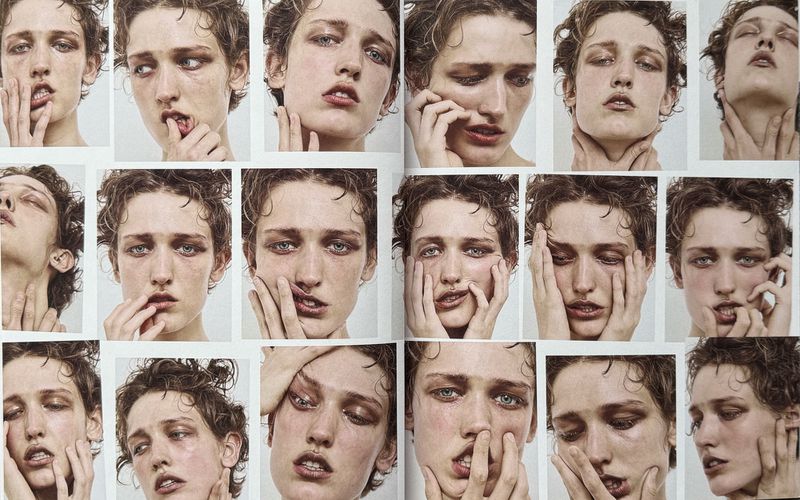 Multiple portrait close-ups of a model with expressive face and hands touching skin in a magazine layout