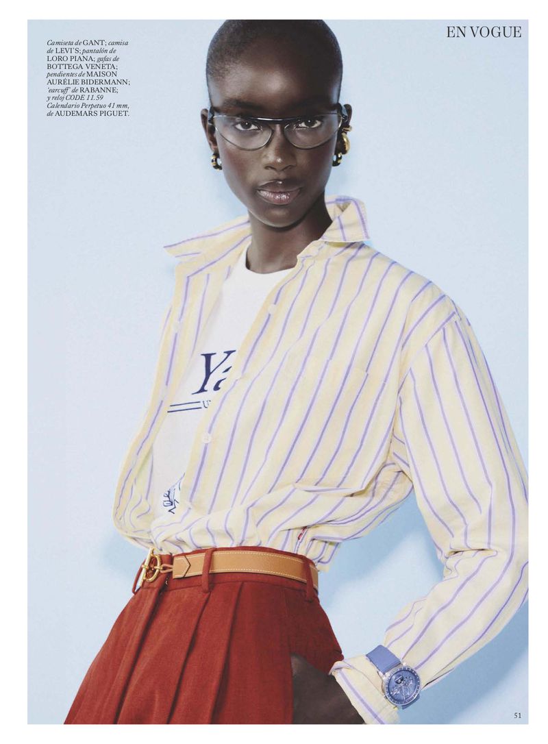 Model Maty Fall wearing a striped button-down shirt and rust skirt for Vogue España editorial photography