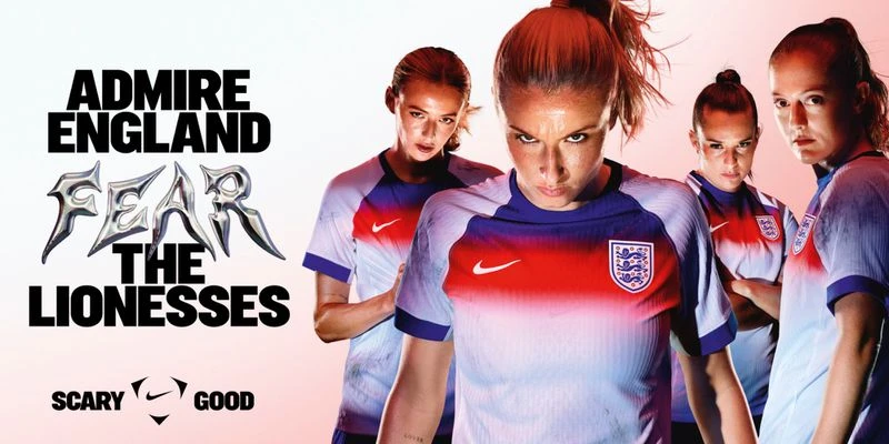 Group shot of England's women's national football team, The Lionesses, in uniform, showcasing team pride and competitive spirit.