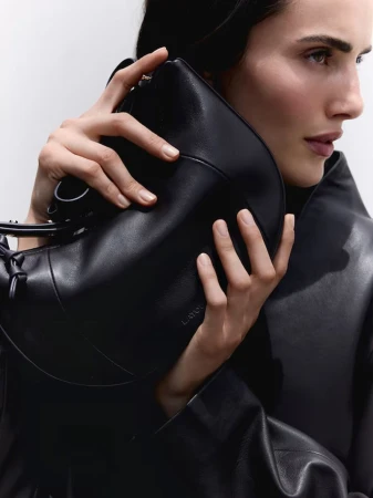 Model Blanca Padilla holding a black leather handbag for the Latouche F/W 2026 campaign by El Corte Ingles, photographed by Selim Soysal.