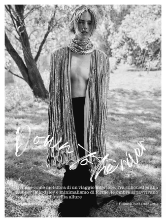 Model in sequined cape and dark trousers outdoors among trees for Marie Claire Italia editorial.