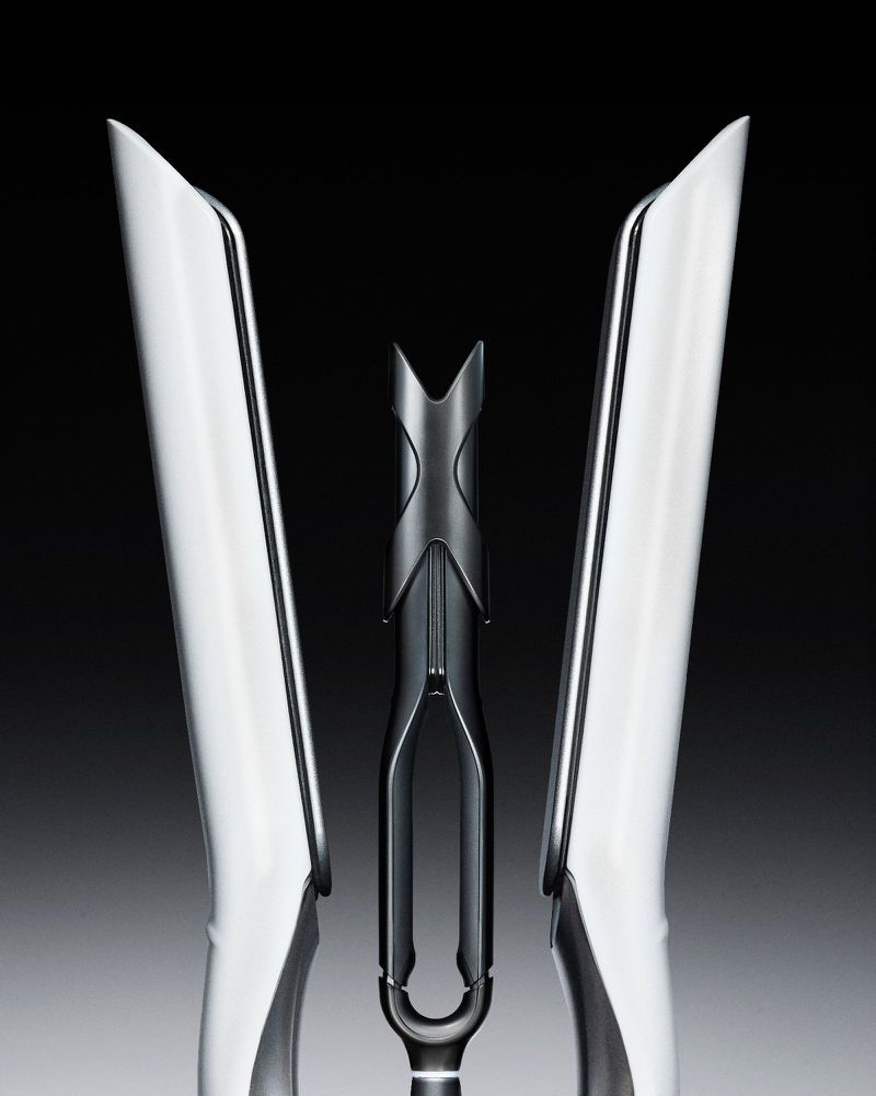 Symmetrical product shot of sleek white hair styling tools with a central black accent against a gradient grey background.
