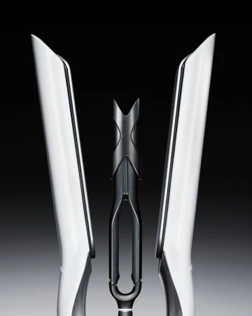 Symmetrical product shot of sleek white hair styling tools with a central black accent against a gradient grey background.