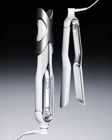 Two white and metallic hair styling tools displayed vertically against a gradient grey background