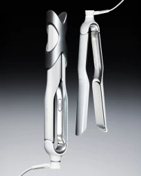 Two white and metallic hair styling tools displayed vertically against a gradient grey background
