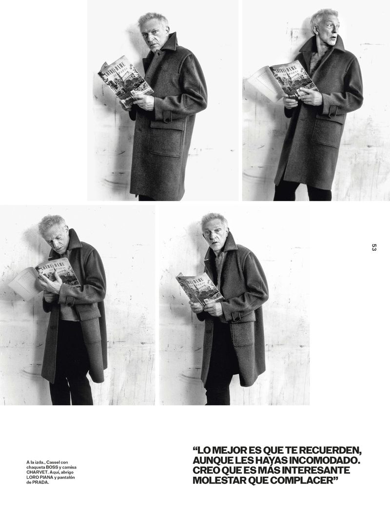 Black and white editorial layout featuring actor Vincent Cassel holding a magazine while wearing a heavy overcoat