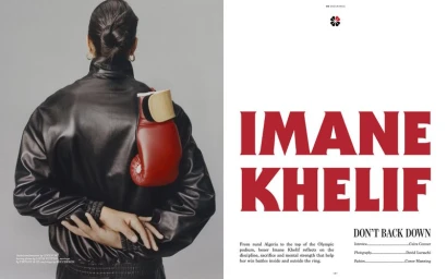 Rear view of boxer Imane Khelif wearing a black leather jacket with a red boxing glove tucked into the shoulder strap