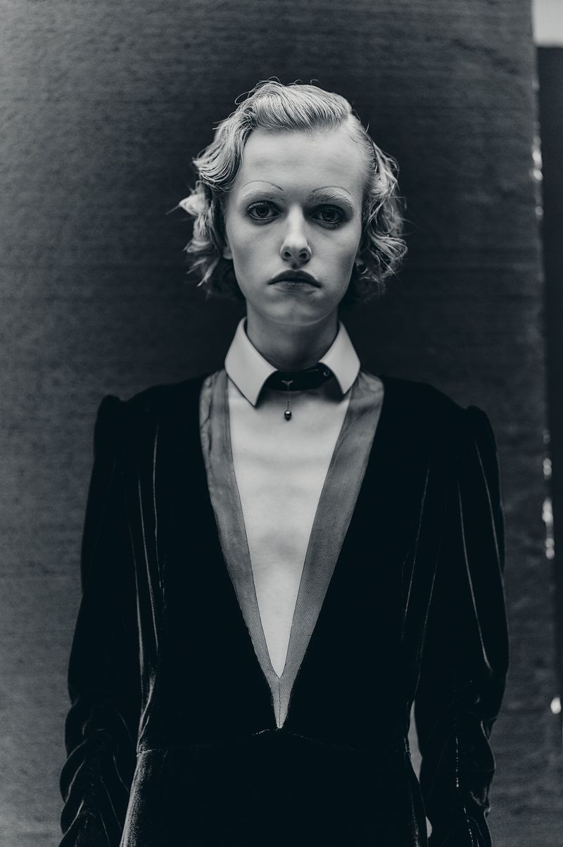 Model Sasha Krivko wearing a dark velvet dress with a white collared inset in a portrait by Thomas Hauser for Crash Magazine.
