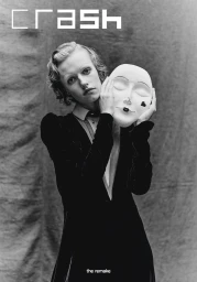 Model holding a theatrical mask in a black velvet dress against a textured backdrop for Crash Magazine.