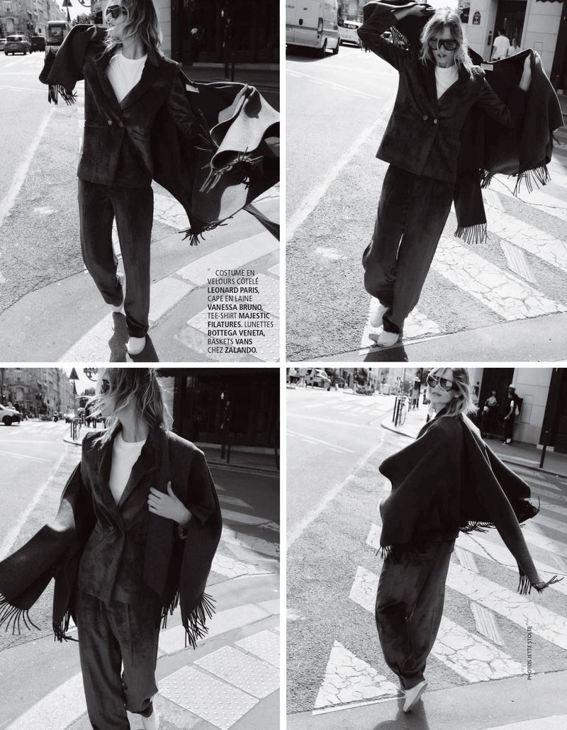 Four-panel black and white editorial featuring a model walking on a city street wearing a dark suit jacket and draped cape.