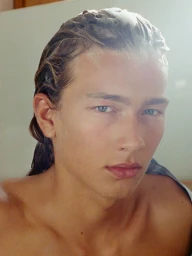 Close-up portrait of model Mack Karpes with damp hair and suds on his forehead for Harper's Bazaar France Homme.