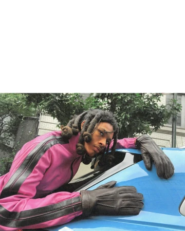 Model wearing a pink jacket and dark leather gloves leaning over the roof of a bright blue car.
