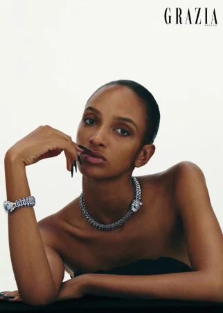 Model wearing diamond panther necklace and bracelet against white background for Grazia Middle East