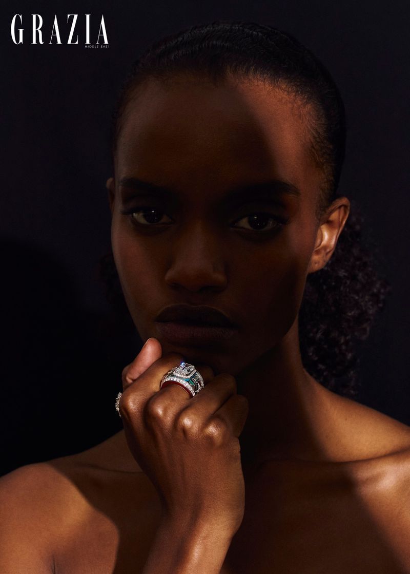 Close-up portrait of a woman wearing a diamond ring with a shadow cast across her face for Grazia Middle East.