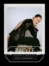 Model Jiahui Zhang wearing a black backless top and trousers against a white backdrop for Rouge Fashionbook.