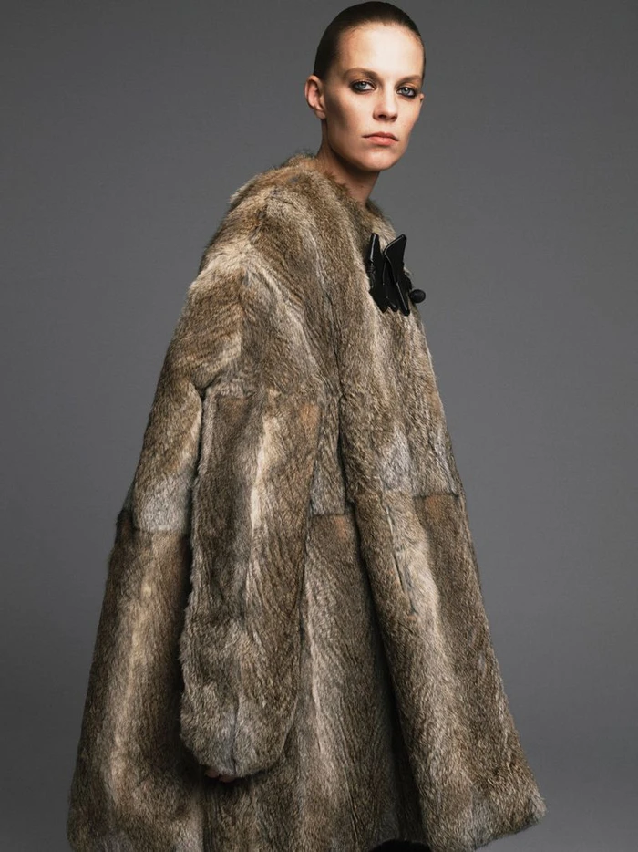 Model Lexi Boling wearing a patterned brown fur coat in a fashion editorial for W Magazine China photographed by Zhong Lin.