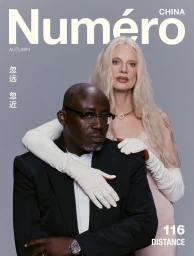 Cover of Numéro China featuring a Black man in a black suit and white shirt with a blonde woman in a pink dress and white gloves.