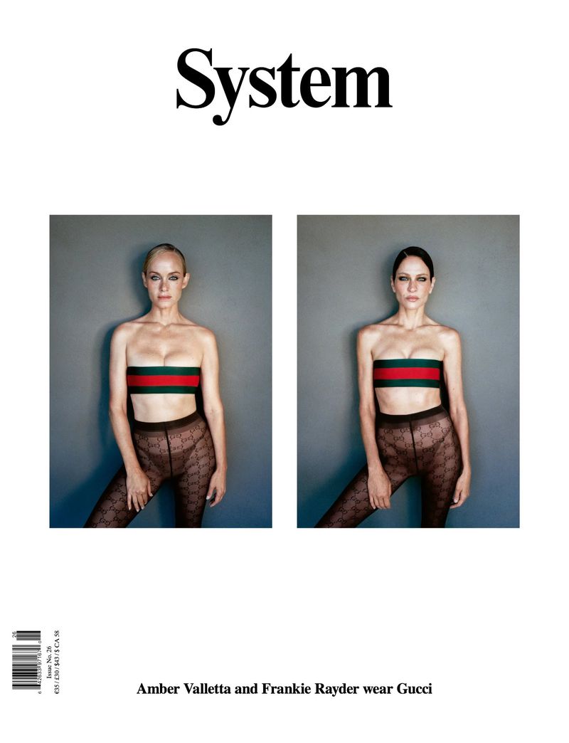 System Magazine cover featuring models Amber Valletta and Frankie Rayder wearing matching strapless tops and patterned tights against a grey studio backdrop.
