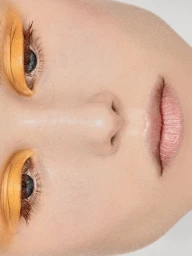 Close-up portrait of model Katrine Steiness featuring vibrant yellow eye makeup for D Repubblica by makeup artist Vanessa Icareg.