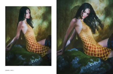 Model with long dark hair wearing a yellow netted halter dress, seated on a moss-covered rock against a textured green background.