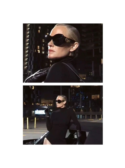 Amber Valletta in oversized black sunglasses and black turtleneck leaning on a car at night for System Magazine