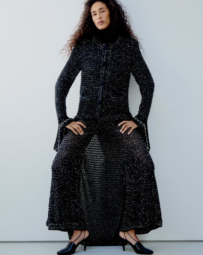 Model Shani Feldman in a textured black tweed coat against a seamless white background for M Le magazine du Monde