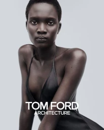 Model Aluel Keror wearing a dark top against a light background for Tom Ford Beauty photographed by Drew Vickers