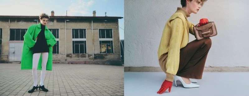 Model in a bright green coat standing outdoors in front of a building facade for a Vogue Greece fashion editorial