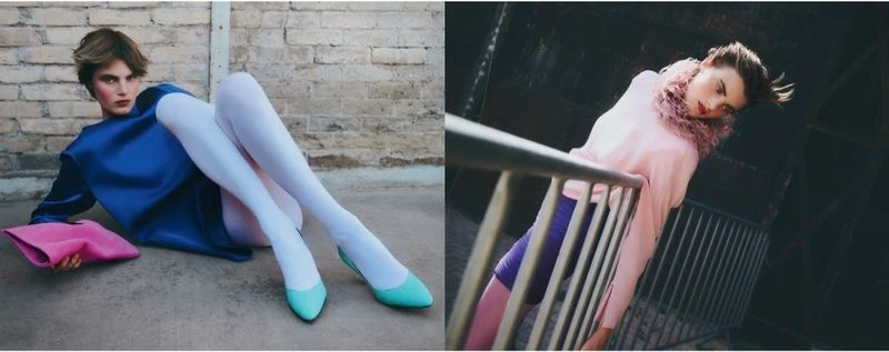 Model in blue top and white tights reclining against a brick wall holding a pink clutch in a fashion editorial for Vogue Greece