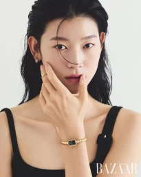 Model Sol Jeong wearing a black top and gold watch for Harper's Bazaar Korea photographed by Shin Sunhye