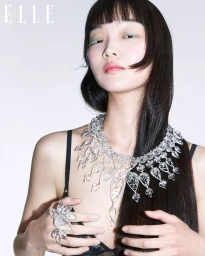 Model Bomi Youn wearing an elaborate diamond necklace and ring in an editorial for Elle Korea photographed by Jang Jungwoo.