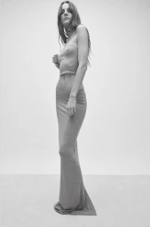 Monochrome studio portrait of Tilda Lindstam wearing a fitted crop top and floor-length maxi skirt for Éterne.