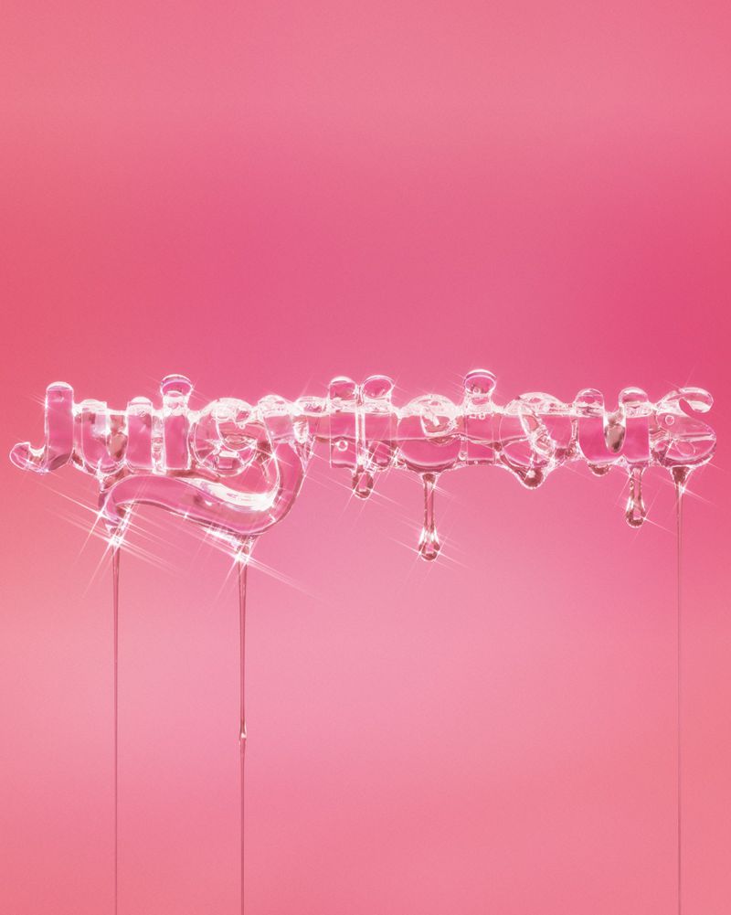 Word 'Juicierlicious' spelled out in liquid with drips on a pink background. Beauty and fashion concept for advertisement.