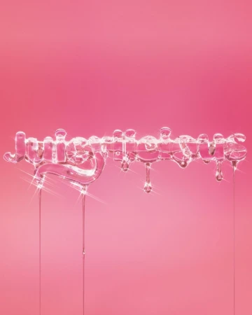 Word 'Juicierlicious' spelled out in liquid with drips on a pink background. Beauty and fashion concept for advertisement.