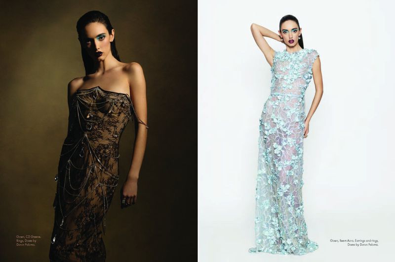 Two fashion models pose in dresses. One model is wearing a black lace dress with chain embellishments and the other a blue flower dress.