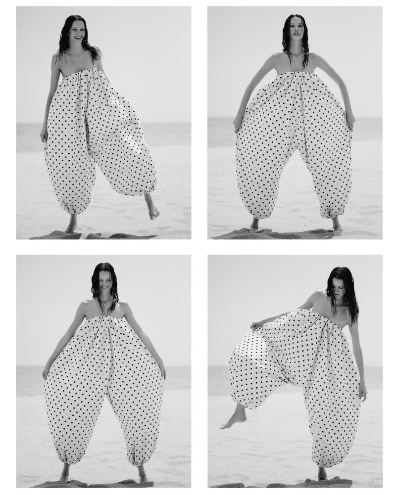 Multiple shots of an adult female model in a white polka-dot garment, posing on a beach with a neutral expression. Fashion editorial.