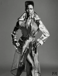 Model Ajah Angau Jok in transparent coat with structured high top haircut in black and white fashion editorial for French Magazine