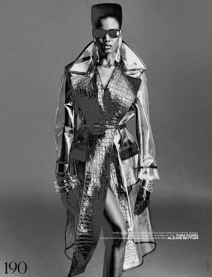 Model Ajah Angau Jok wearing a transparent trench coat and sunglasses for French Magazine, photographed by Mikael Schulz.