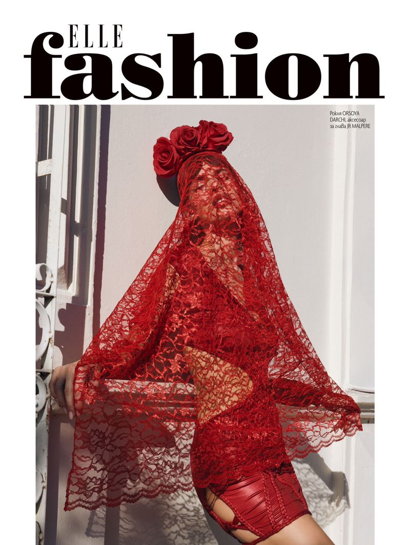 Elle Fashion magazine cover featuring a woman in a red lace bodysuit with a veil and red roses, leaning against a white wall.