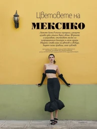 Model Keltie Straith posing against a yellow and green wall in black two piece outfit for Elle Bulgaria