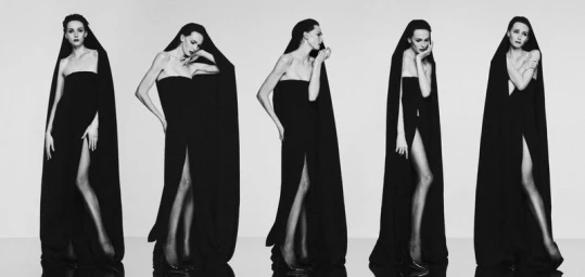 Alex Consani in a black strapless gown with a draped hood in a sequence of poses for WSJ The New Sexy editorial.