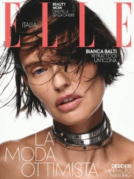 Model Bianca Balti on the cover of Elle Italia with wet hair and a metal choker necklace against a white background.