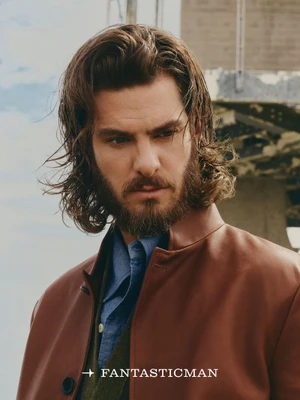 Andrew Garfield with long hair and beard wearing a brown jacket and blue shirt for Fantastic Man China photographed by Micaiah Carter.