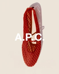 Top-down view of a red mesh Mary Jane flat on a neutral background with white A.P.C. logo text overlay.