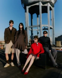 Four models posing on a rooftop in front of a water tower for the Iceberg SS26 collection campaign by Gautier Pellegrin.