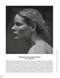 Black and white profile portrait of model Marlijn Hoek wearing an under-eye skincare patch in an editorial layout.